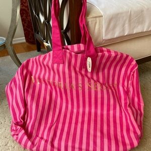 Victoria’s Secret pink striped large duffel bag.